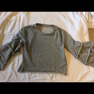 NWOT Grey top with ruffled sleeves.